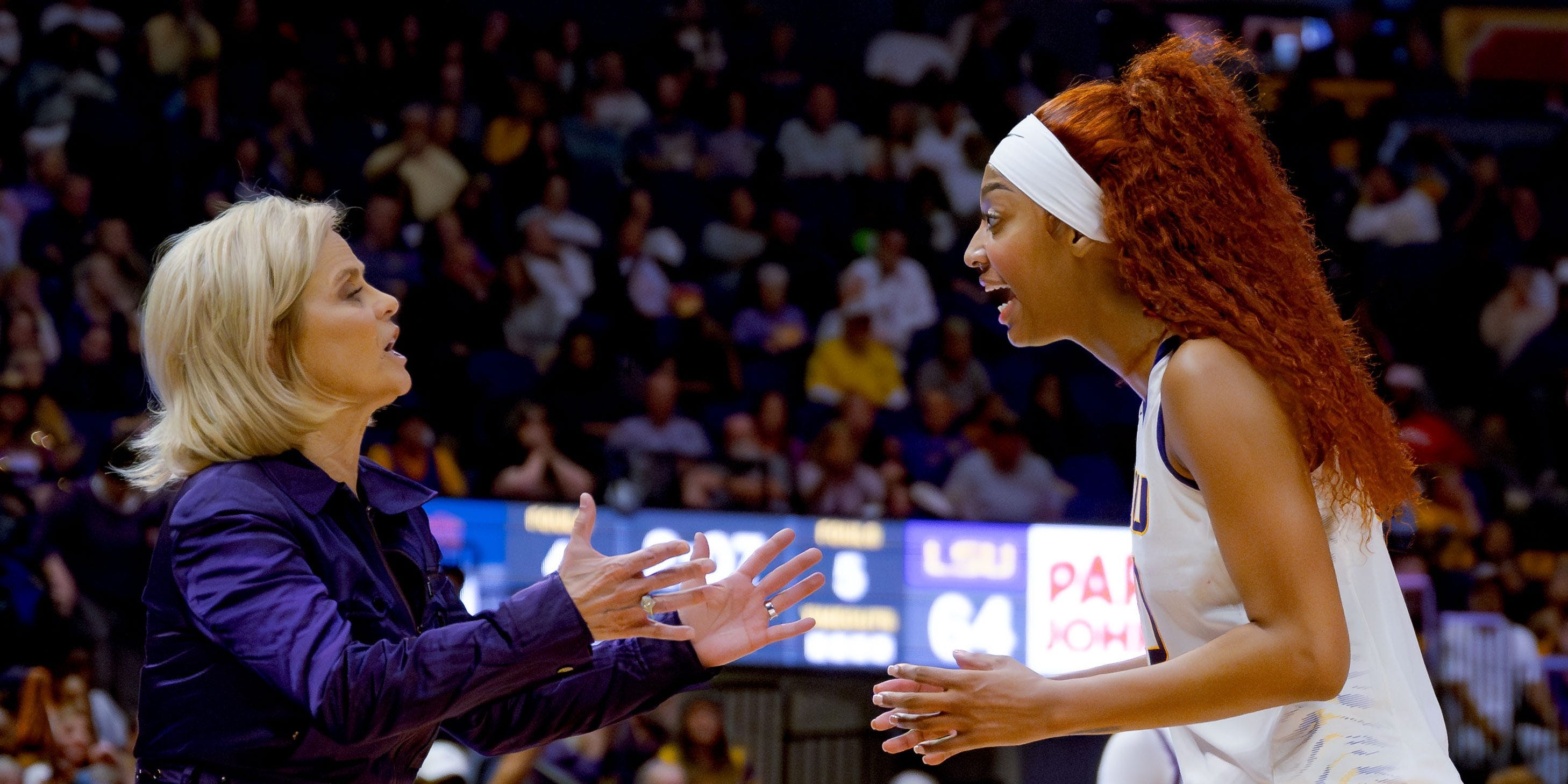 Feb 22, 2024; Baton Rouge, Louisiana, USA; LSU Lady Tigers head coach Kim Mulkey, left, and LSU Lady Tigers forward Angel Reese talk during the second half against the Auburn Tigers at Pete Maravich Assembly Center. Mandatory Credit: Matthew Hinton-USA TODAY Sports ORG XMIT: IMAGN-731529 ORIG FILE ID: 20240222_cec_ft8_345.JPG